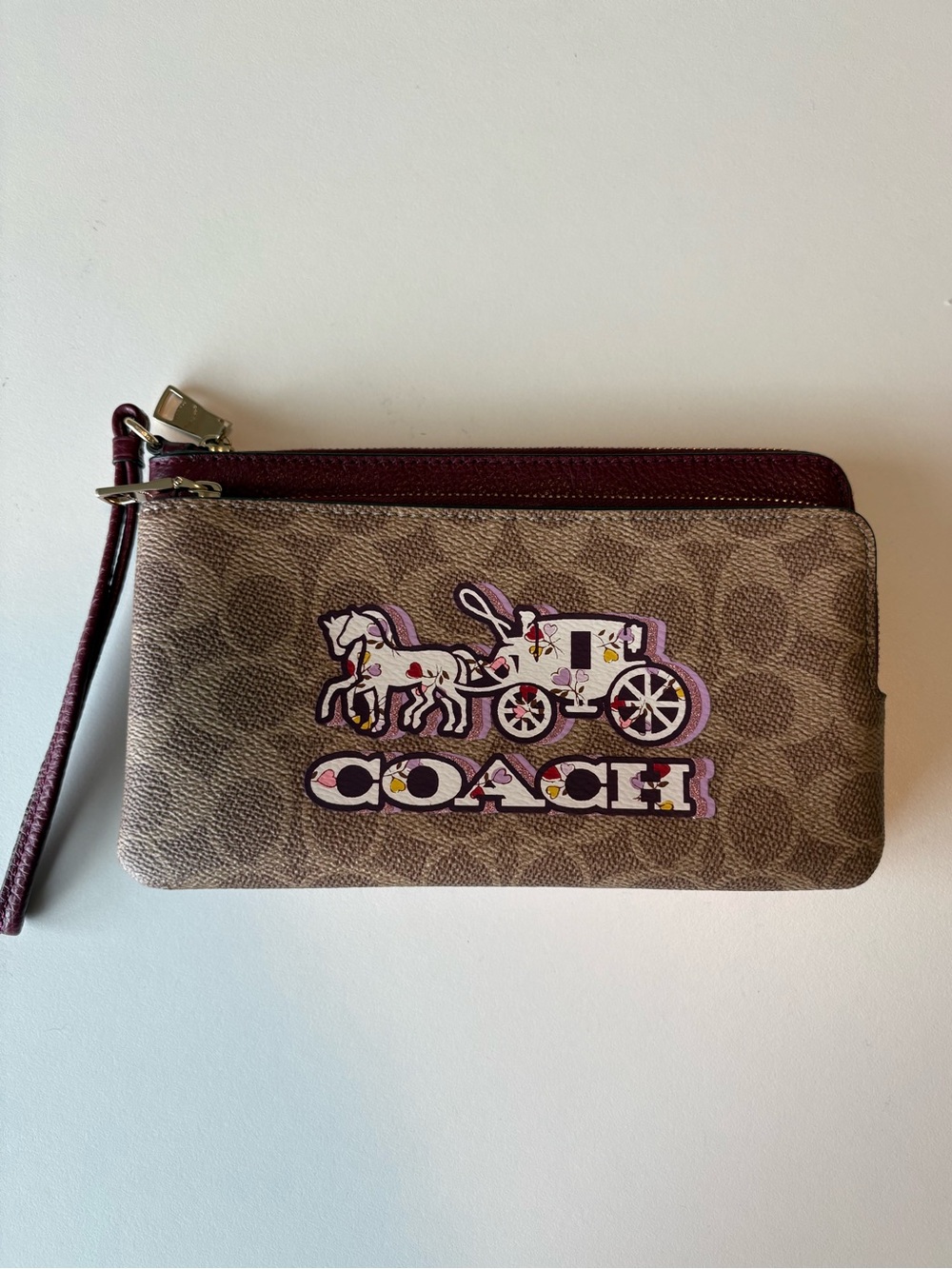 Coach Corner Zip Wristlet In Signature Canvas With Horse And Carriage Print